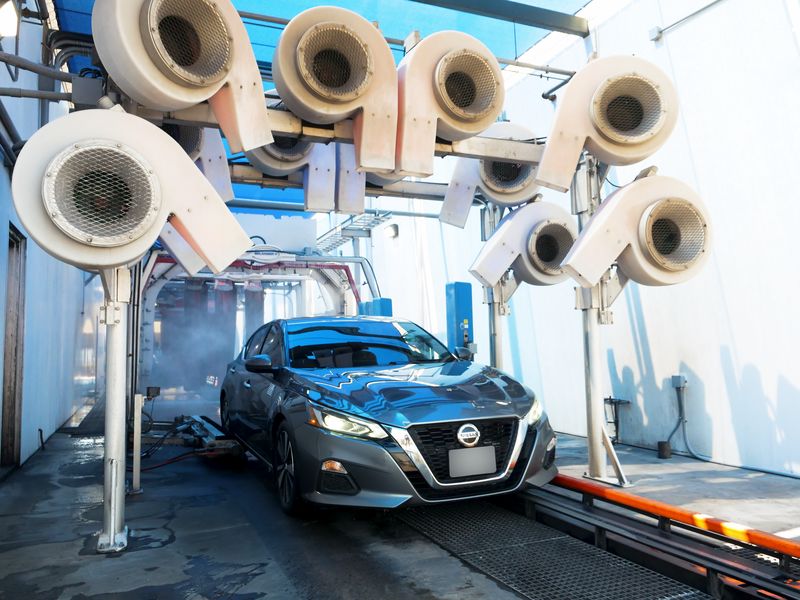 Overhead dryers above a car at the tunnel exit