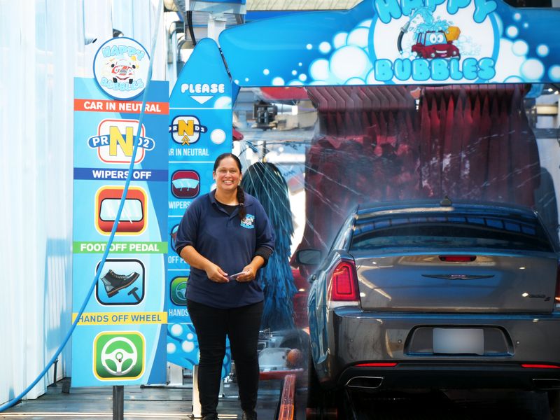 Smiling team member at the tunnel entrance