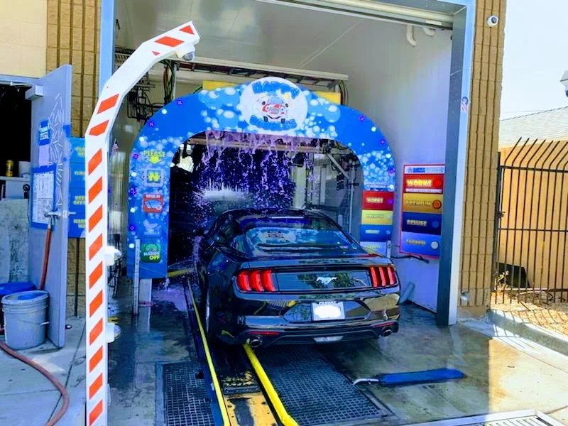 Black Mustang entering the San Diego tunnel under the Happy Bubbles arch