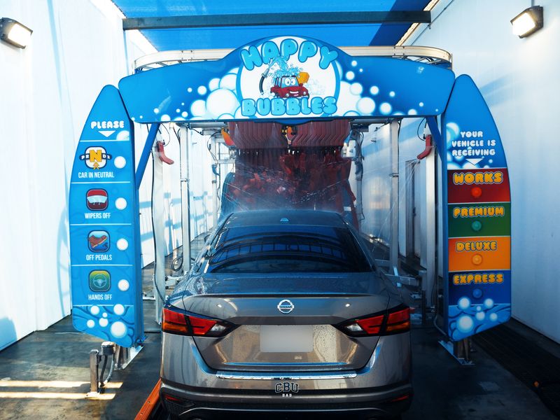 Car entering the Ontario tunnel under the Happy Bubbles arch
